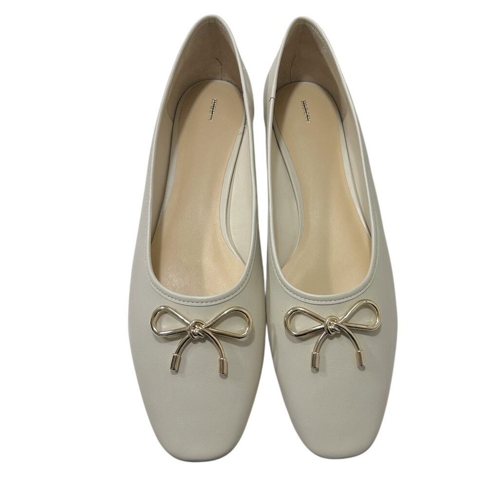 Maeve Cream Ballet Flats with Gold Bow Accent